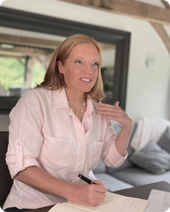 Georgia Davies sitting at a desk as the OCD Guru